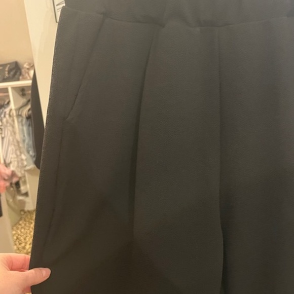 Black pleated dress pants with pockets and elastic waste band (L). NWOT - Picture 2 of 3